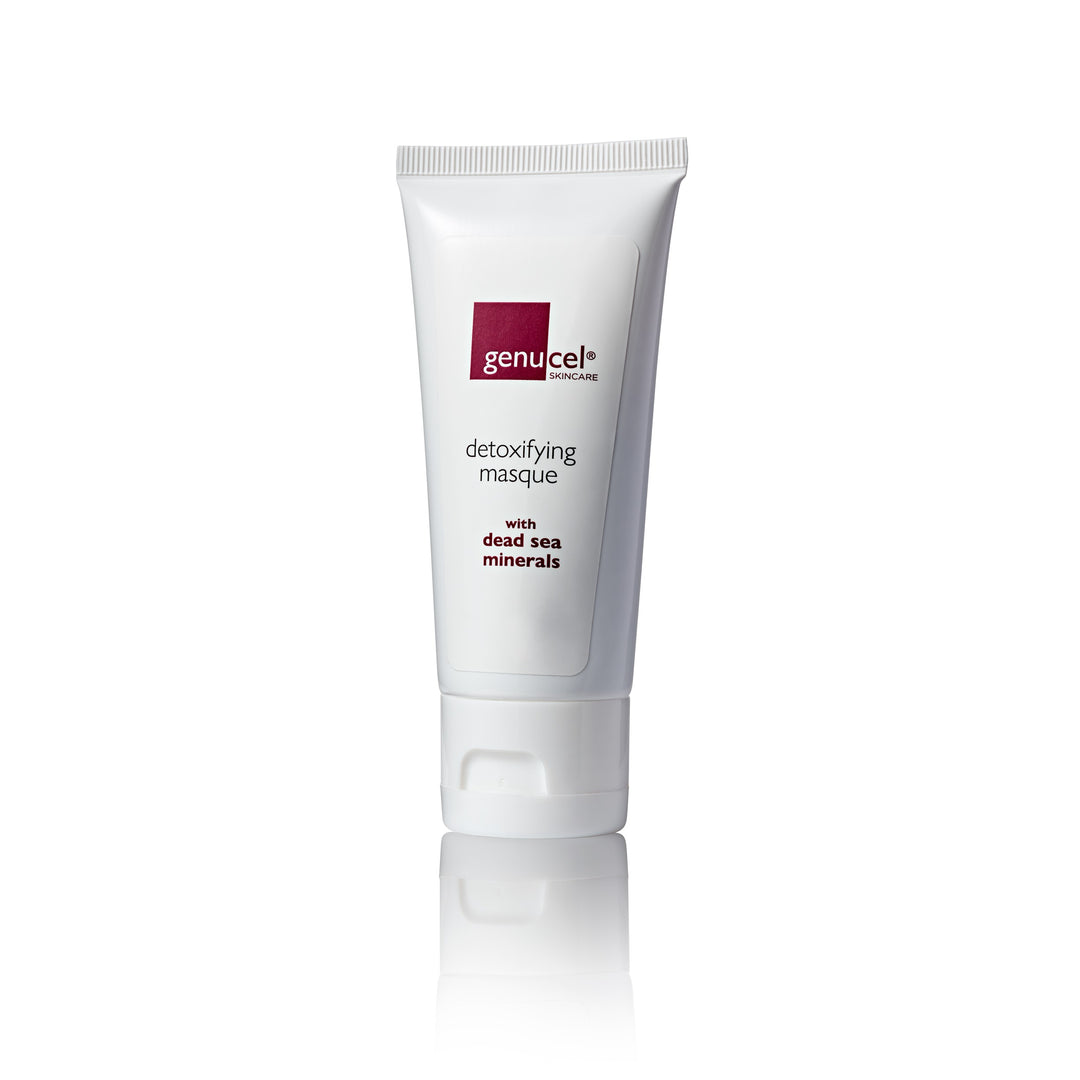 A tube of Genucel Detoxifying Mineral Masque with dead sea minerals, predominantly white with red and black text.